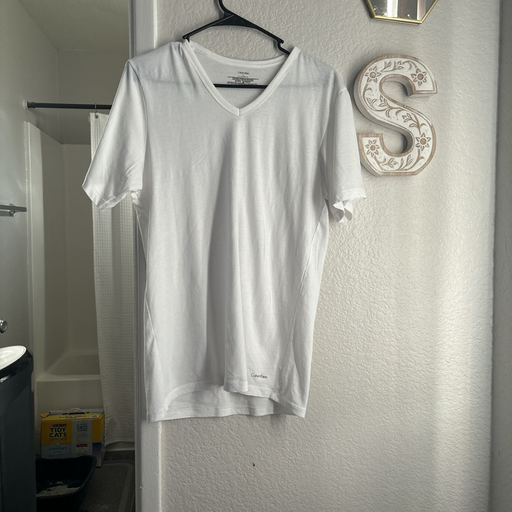 Calvin Klein White V neck tshirt.